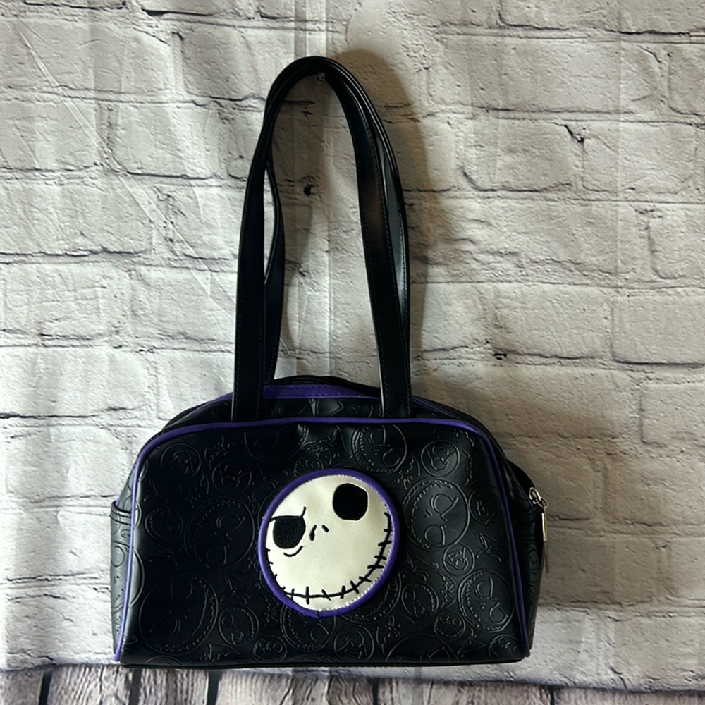 Night Before Christmas black purse w/ purple lining. In great condition,no flaws